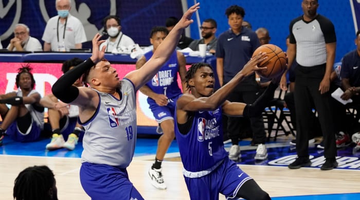 Team Weaver Terquavion Smith (5) is defended by Team Curry Kenny Lofton Jr. during the 2022 NBA Draft Combine at Wintrust Arena.